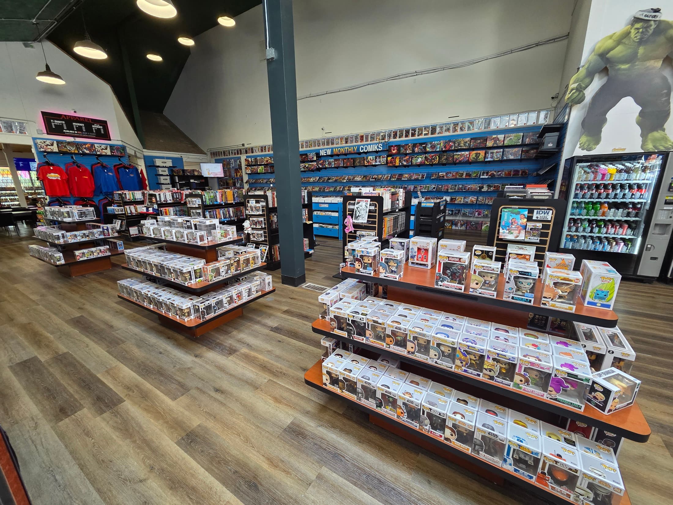 Interior shop aisles and collectible displays at Comiks The Gathering