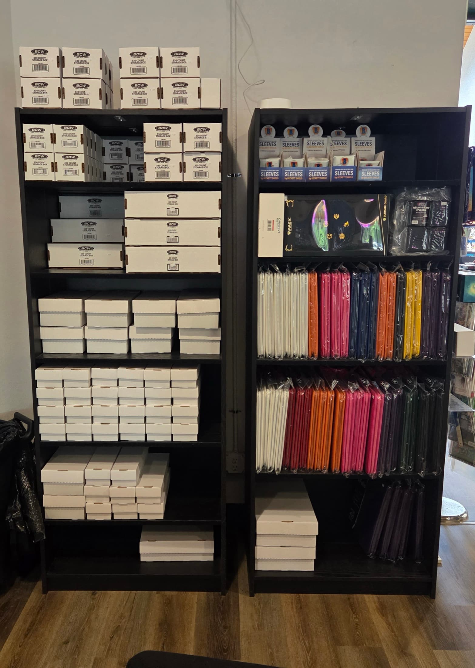 Trading card boxes and sleeves at Comiks The Gathering
